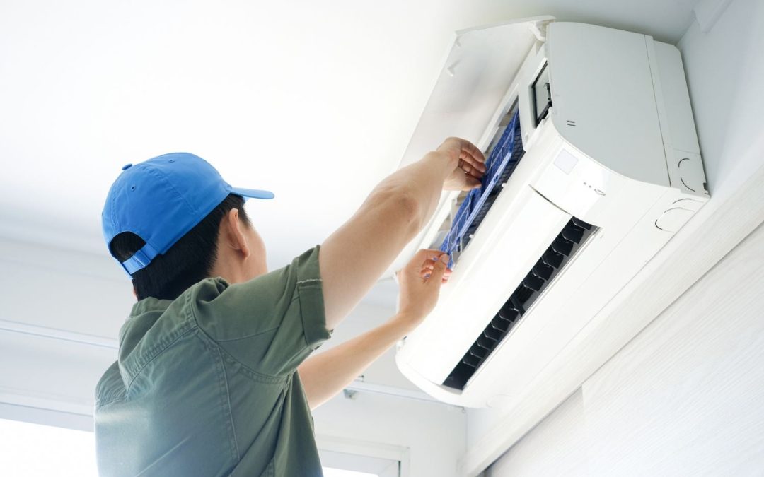 Air conditioning technician maintaining an indoor mini split system in Maricopa, AZ